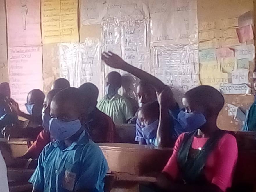 Children at Covid 19 seminar at school.jpeg